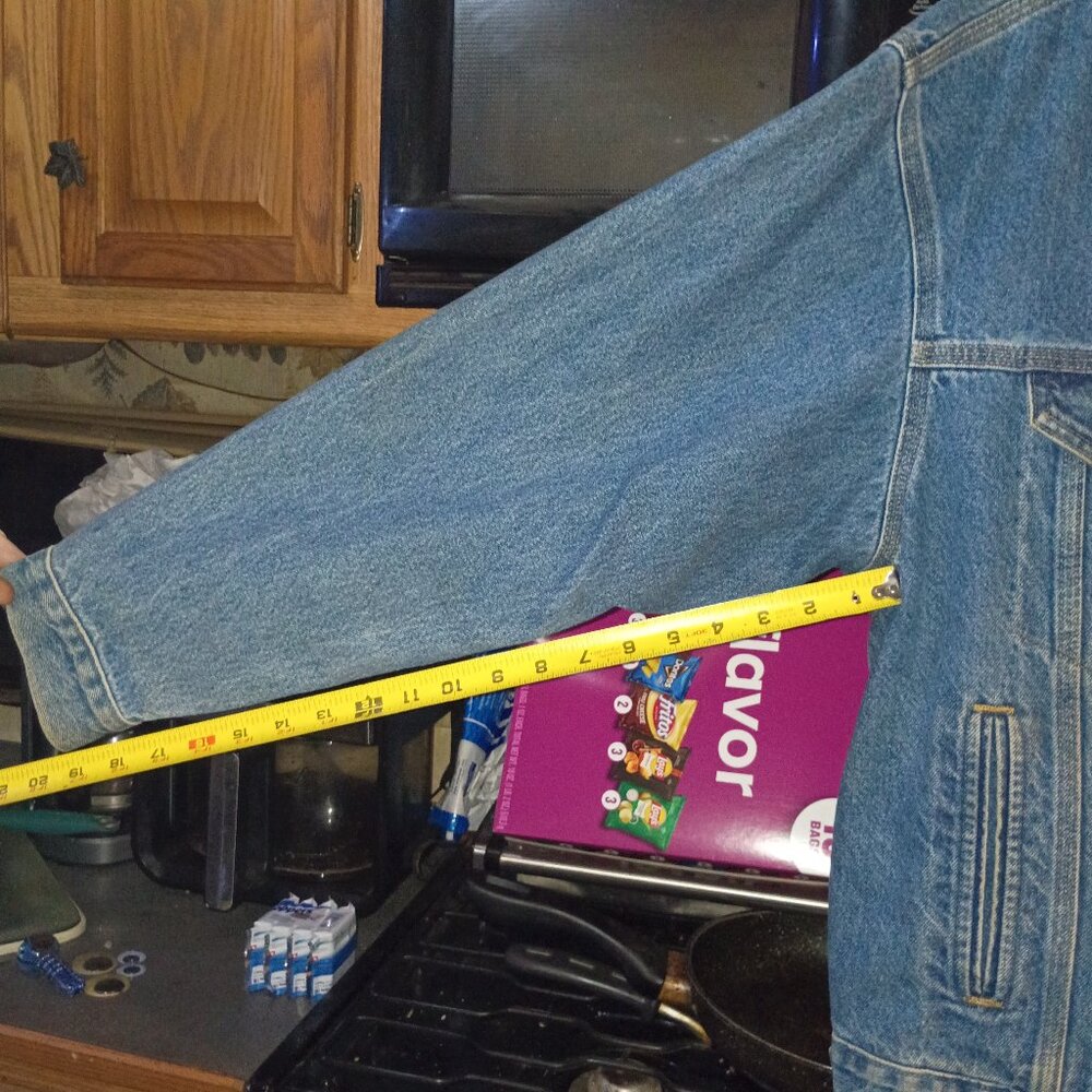 Men mid sized Carhartt denim jacket with a motorcycle dry run patch